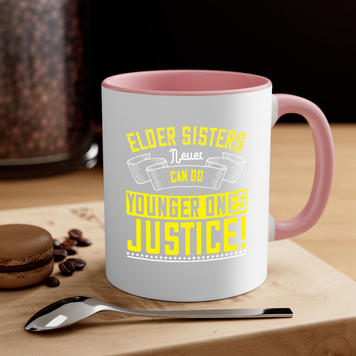 A stylish two-tone ceramic mug with a colored handle and interior, featuring the phrase 'elder sisters never can do younger ones justice' in a glossy finish.