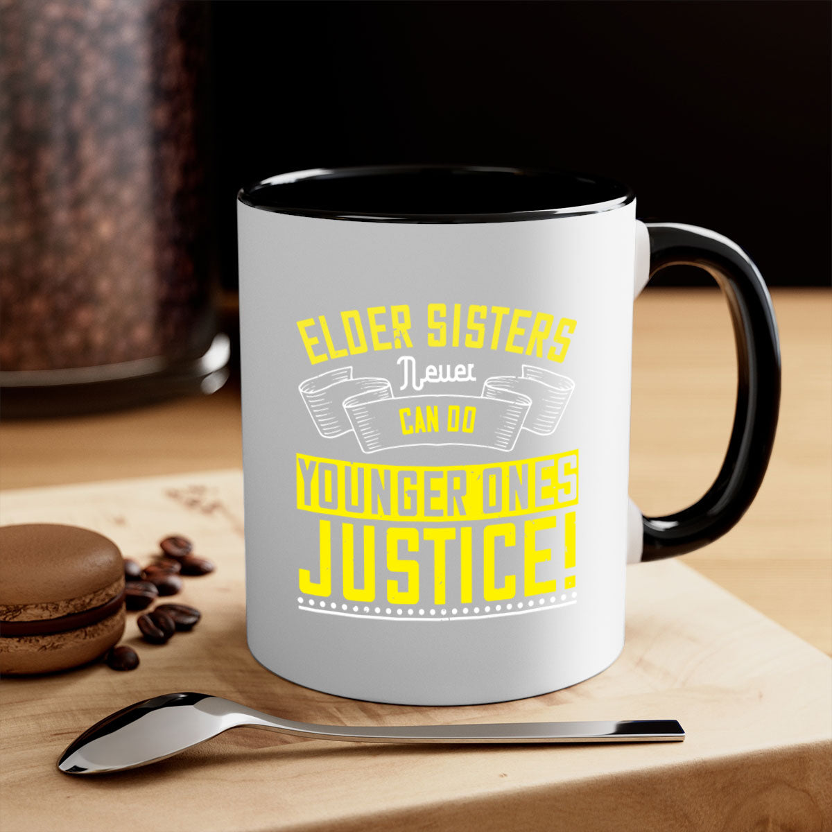A stylish two-tone ceramic mug with a colored handle and interior, featuring the phrase 'elder sisters never can do younger ones justice' in a glossy finish.
