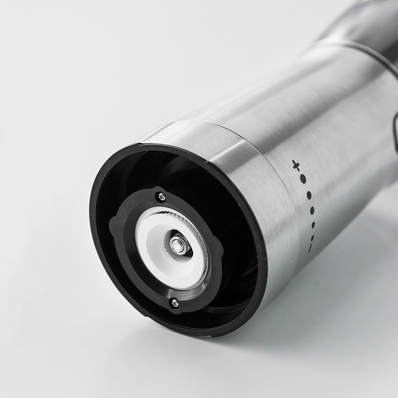 Electric Coffee Grinder made of stainless steel, featuring USB charging and a sleek design, ideal for grinding coffee beans and spices.