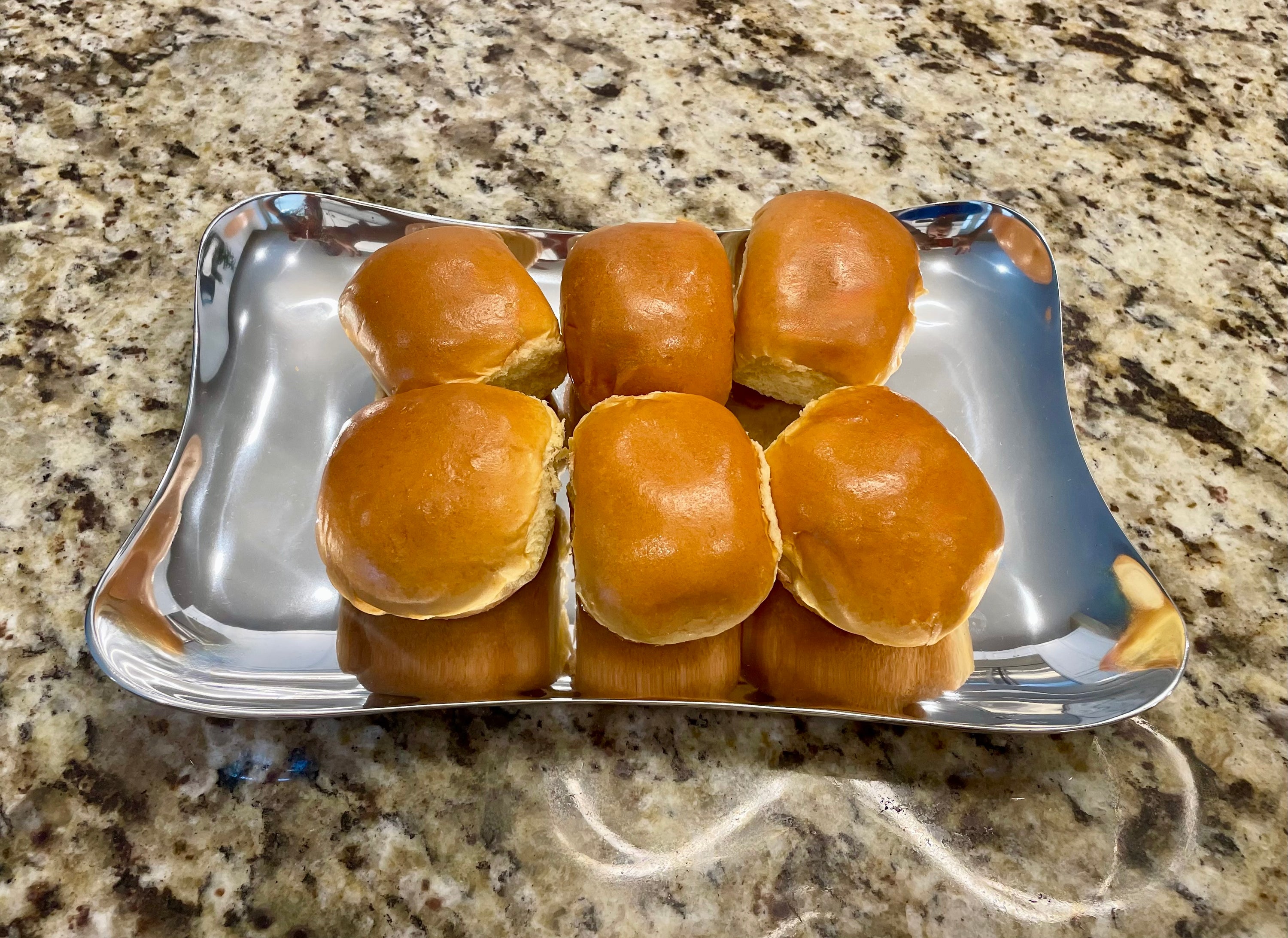 Elegant Serving Tray made of aluminum with a minimalist design, featuring round-shaped corners and a brushed finish.