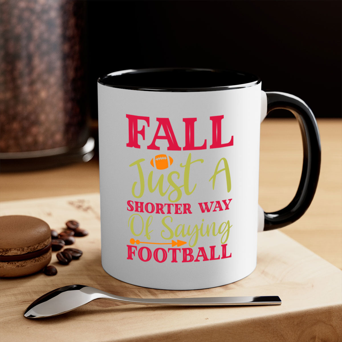 A stylish two-tone coffee mug with a colored handle and glossy finish, featuring the phrase 'Fall Is Just A Shorter Way Of Saying Football'.