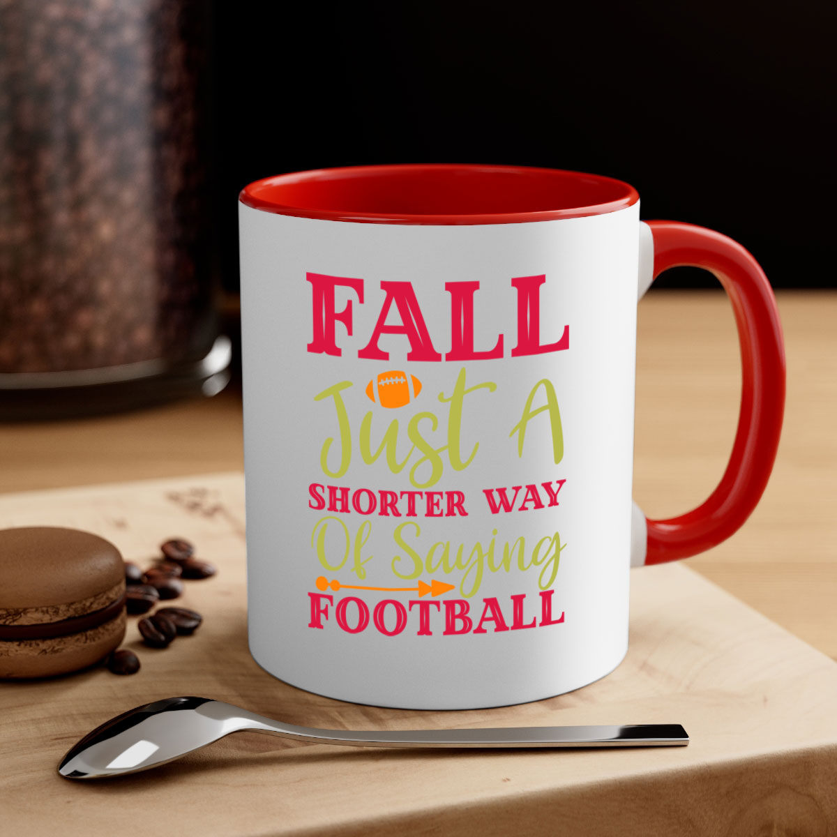 A stylish two-tone coffee mug with a colored handle and glossy finish, featuring the phrase 'Fall Is Just A Shorter Way Of Saying Football'.
