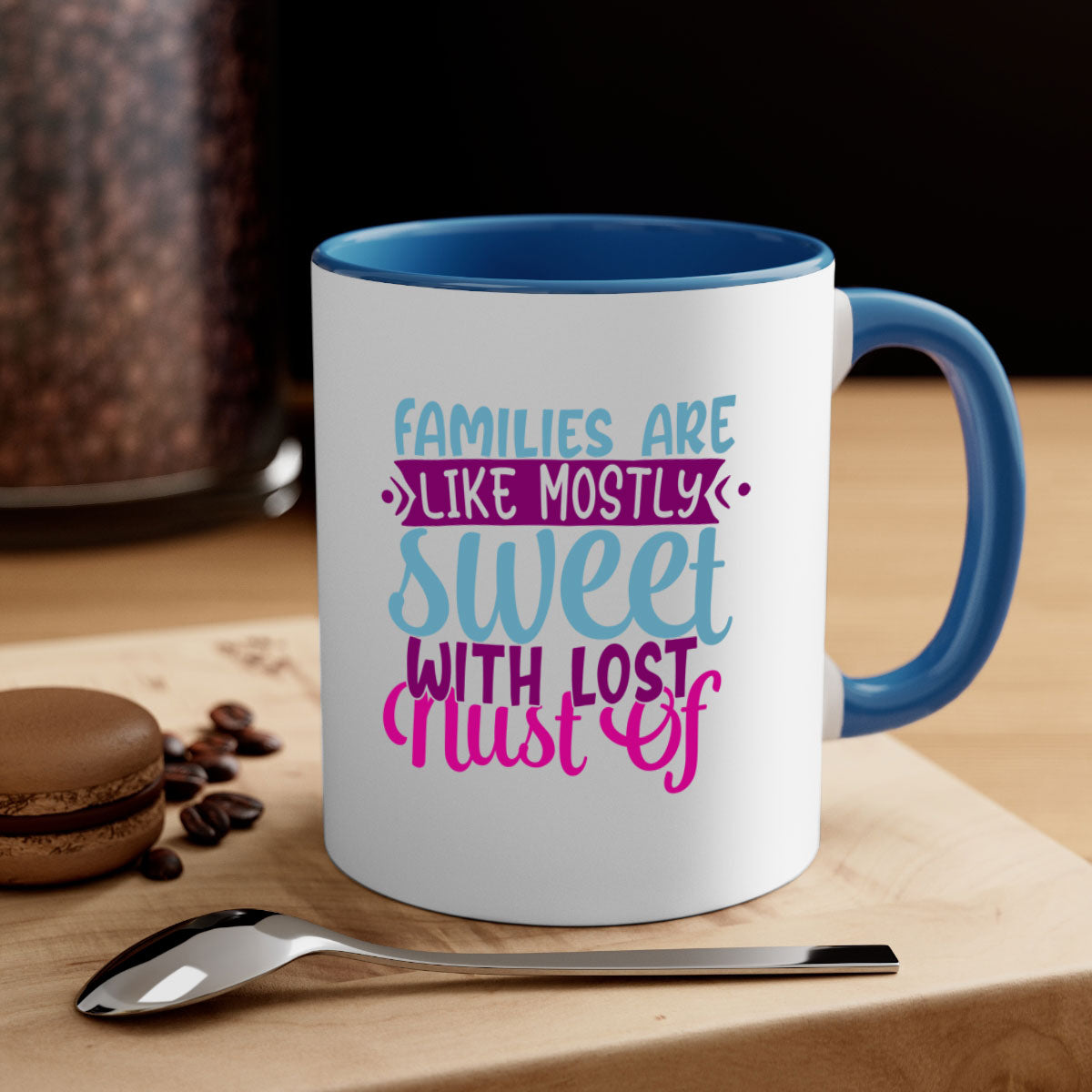 A two-tone ceramic mug with a glossy finish, featuring the quote 'Families Are Like Mostly Sweet' in a stylish font, available in multiple colors.