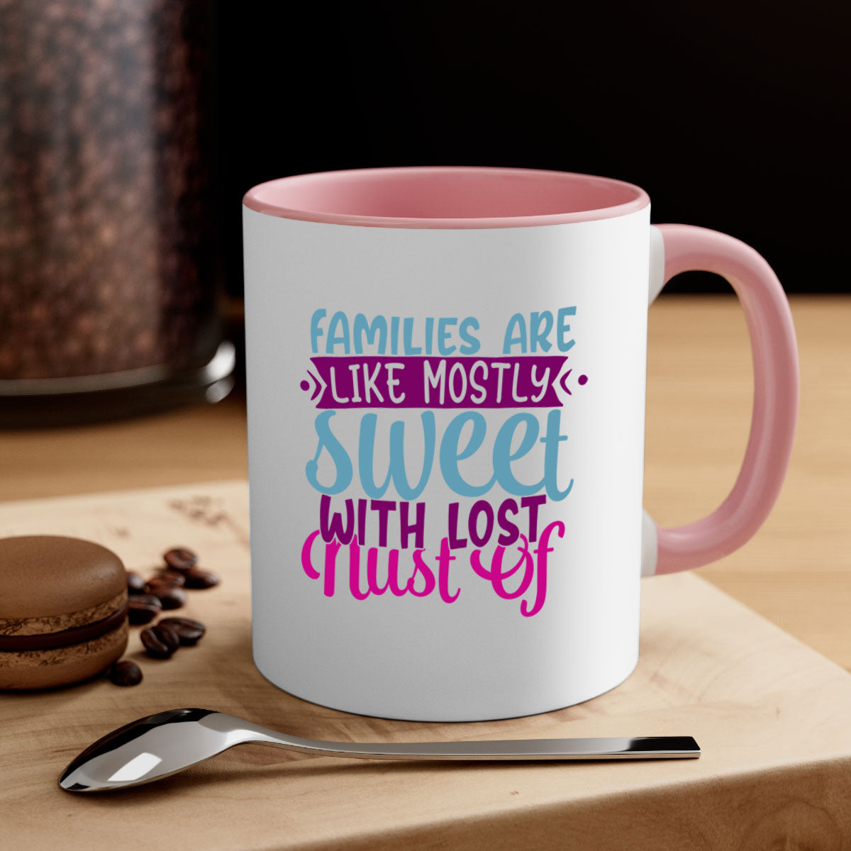 A two-tone ceramic mug with a glossy finish, featuring the quote 'Families Are Like Mostly Sweet' in a stylish font, available in multiple colors.