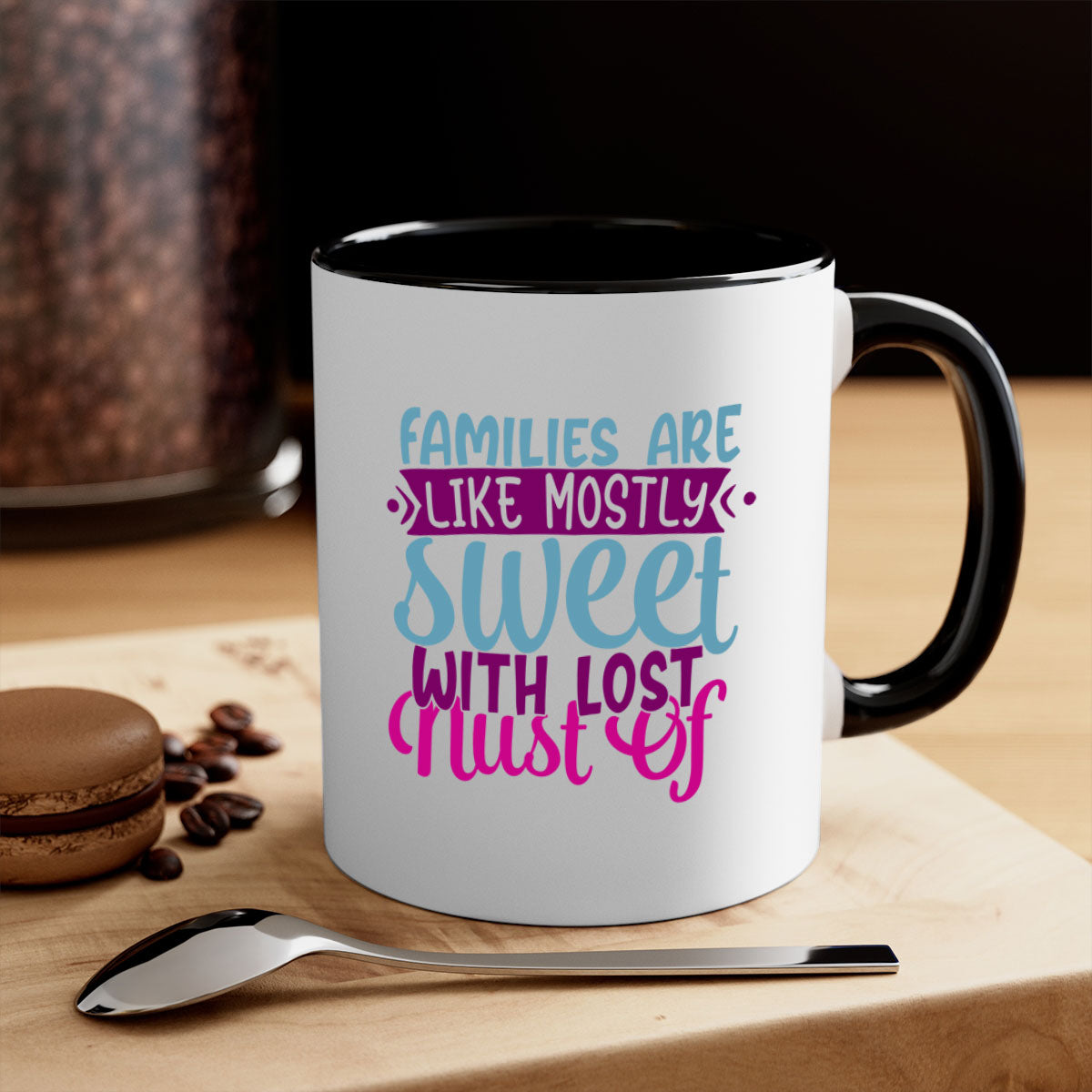 A two-tone ceramic mug with a glossy finish, featuring the quote 'Families Are Like Mostly Sweet' in a stylish font, available in multiple colors.