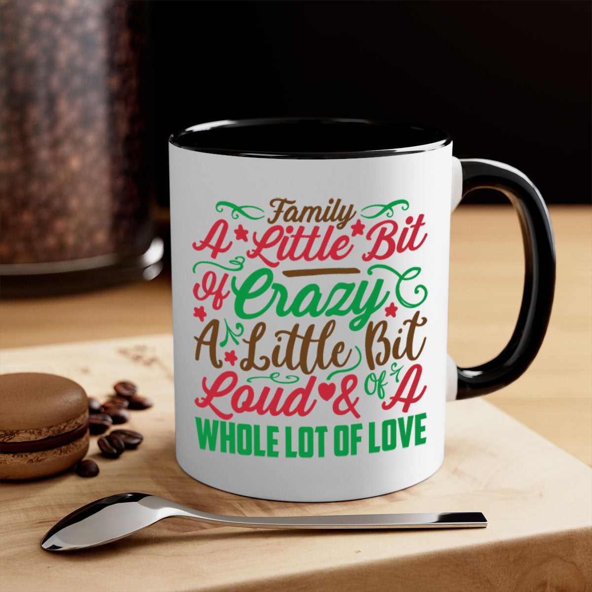 Ceramic mug with colorful handle and interior, featuring the phrase 'A Little Bit of Crazy A Little Bit of Loud A Whole Lot of Love'.