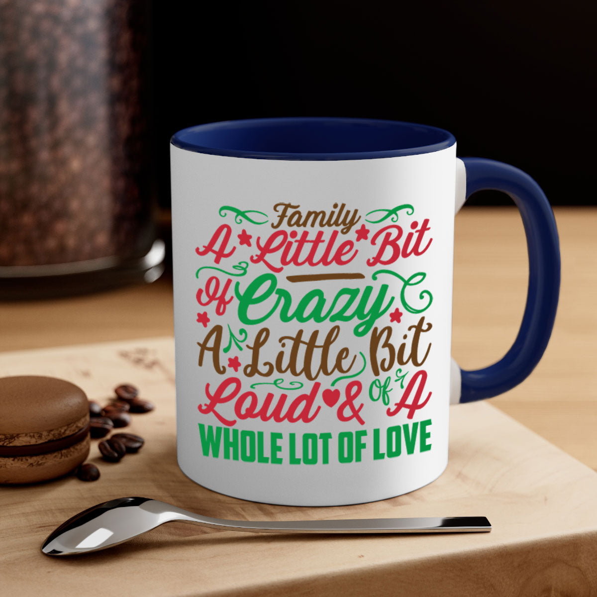 Ceramic mug with colorful handle and interior, featuring the phrase 'A Little Bit of Crazy A Little Bit of Loud A Whole Lot of Love'.
