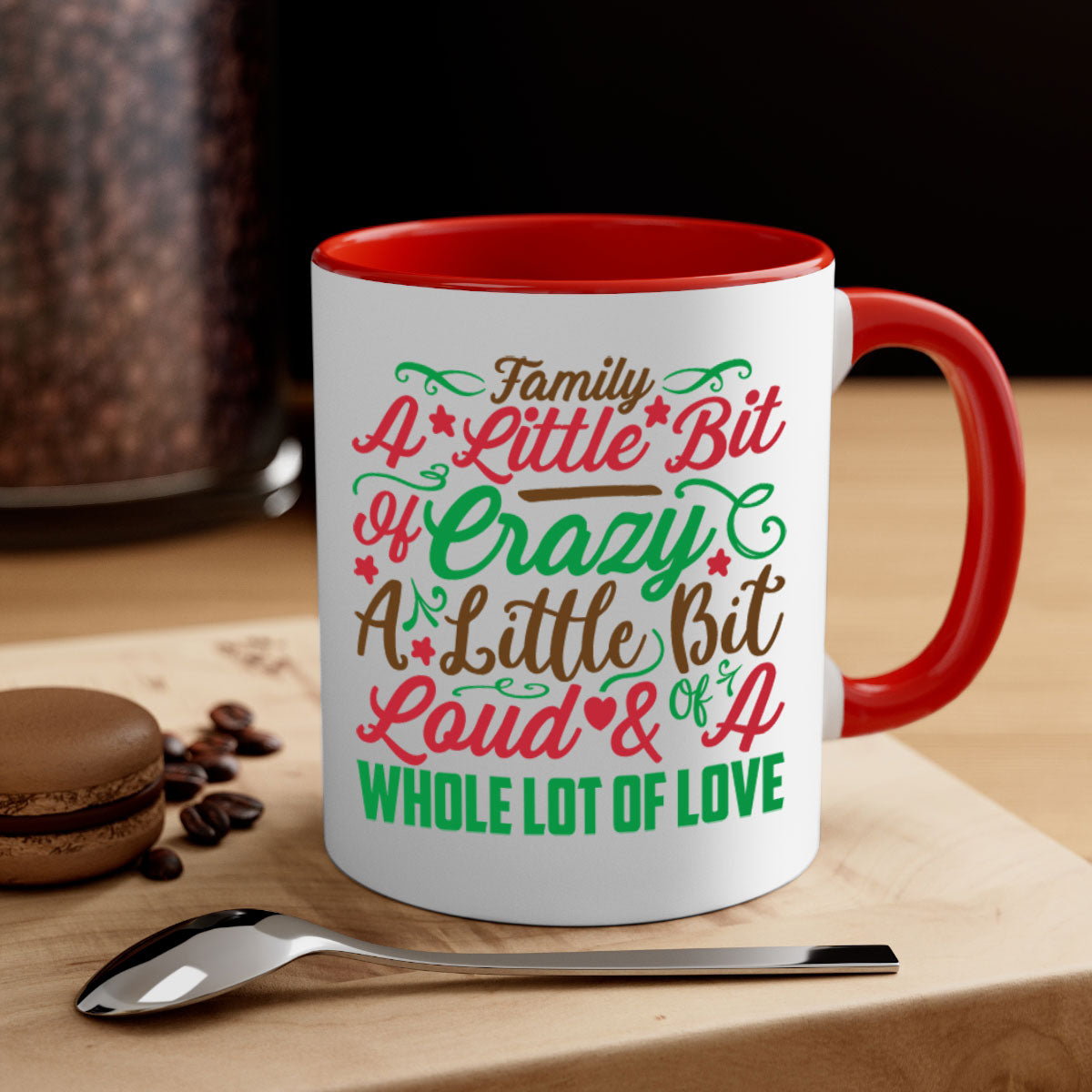 Ceramic mug with colorful handle and interior, featuring the phrase 'A Little Bit of Crazy A Little Bit of Loud A Whole Lot of Love'.