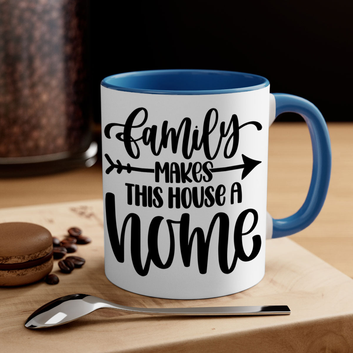 A stylish two-tone ceramic mug with the phrase 'Family Makes This House a Home', featuring a colored handle and glossy finish.