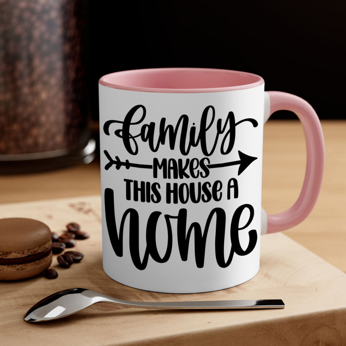 A stylish two-tone ceramic mug with the phrase 'Family Makes This House a Home', featuring a colored handle and glossy finish.