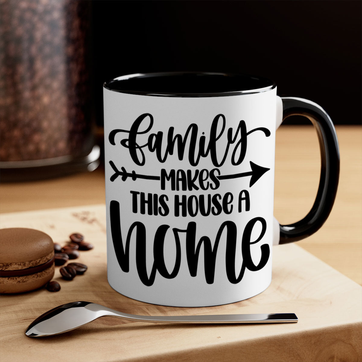 A stylish two-tone ceramic mug with the phrase 'Family Makes This House a Home', featuring a colored handle and glossy finish.