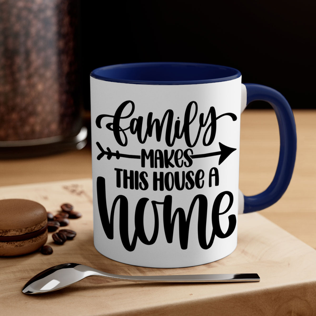 A stylish two-tone ceramic mug with the phrase 'Family Makes This House a Home', featuring a colored handle and glossy finish.