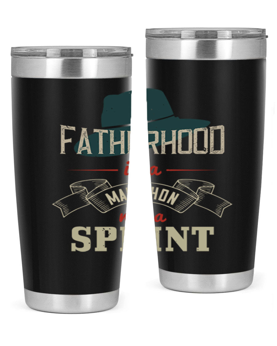 A stylish 'Fatherhood is a Marathon' tumbler in stainless steel, featuring a drink-thru lid and vibrant print, perfect for hot and cold beverages.