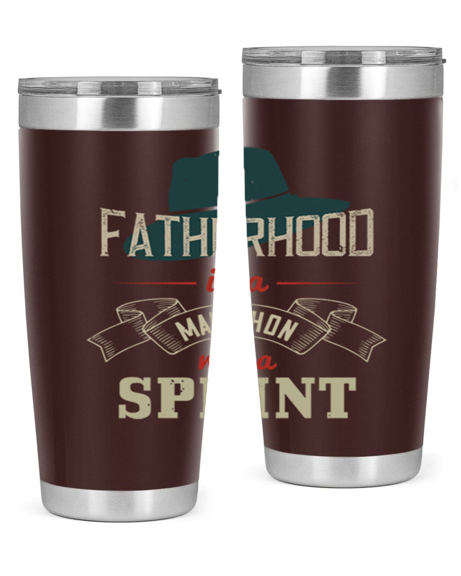 A stylish 'Fatherhood is a Marathon' tumbler in stainless steel, featuring a drink-thru lid and vibrant print, perfect for hot and cold beverages.