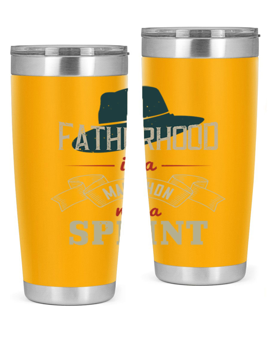 A stylish 'Fatherhood is a Marathon' tumbler in stainless steel, featuring a drink-thru lid and vibrant print, perfect for hot and cold beverages.