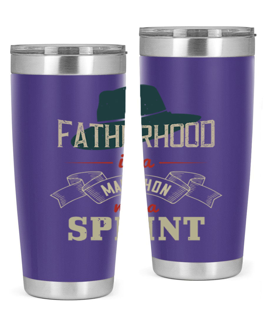 A stylish 'Fatherhood is a Marathon' tumbler in stainless steel, featuring a drink-thru lid and vibrant print, perfect for hot and cold beverages.