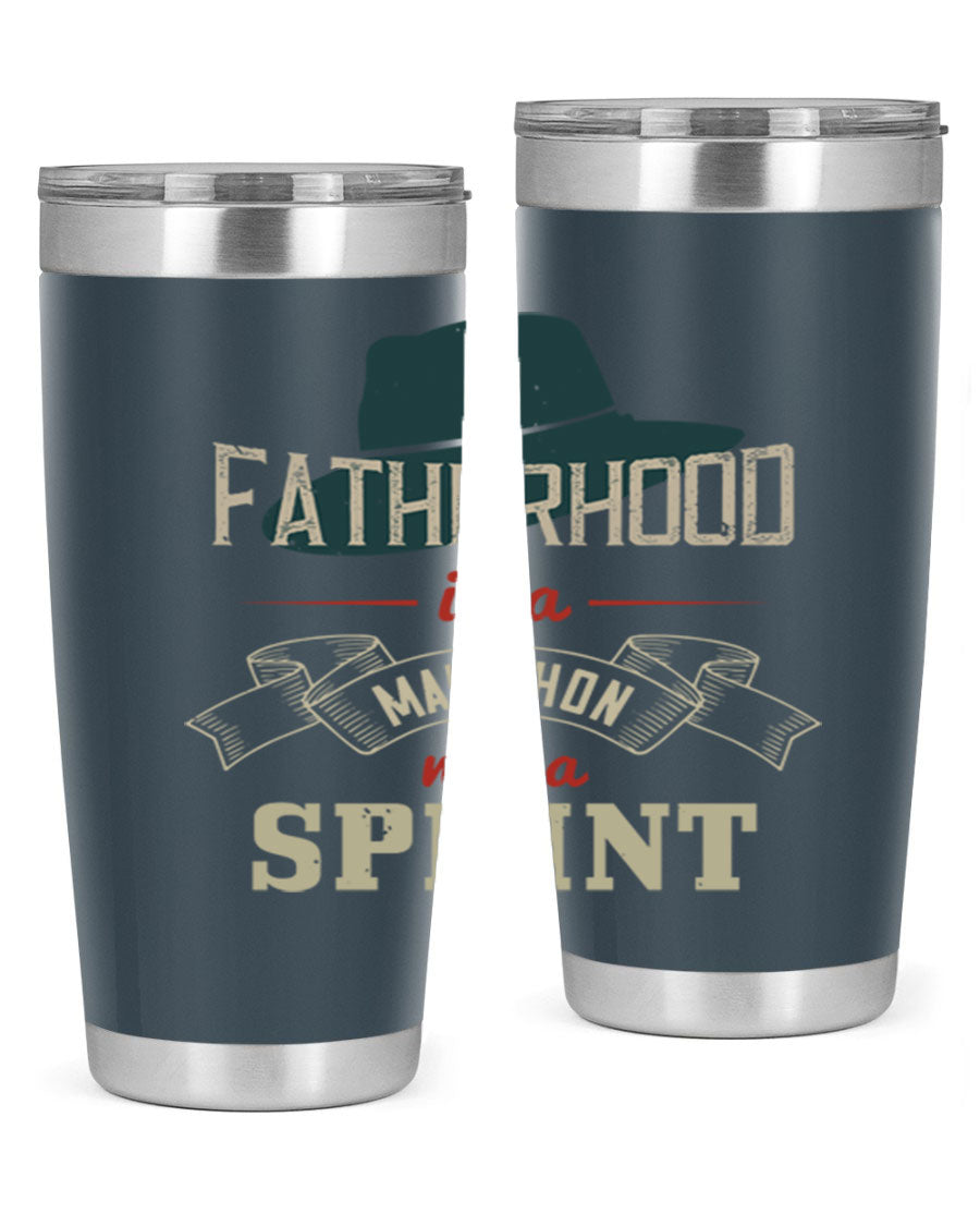 A stylish 'Fatherhood is a Marathon' tumbler in stainless steel, featuring a drink-thru lid and vibrant print, perfect for hot and cold beverages.