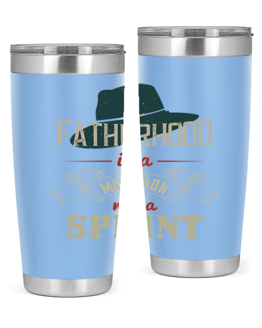 A stylish 'Fatherhood is a Marathon' tumbler in stainless steel, featuring a drink-thru lid and vibrant print, perfect for hot and cold beverages.