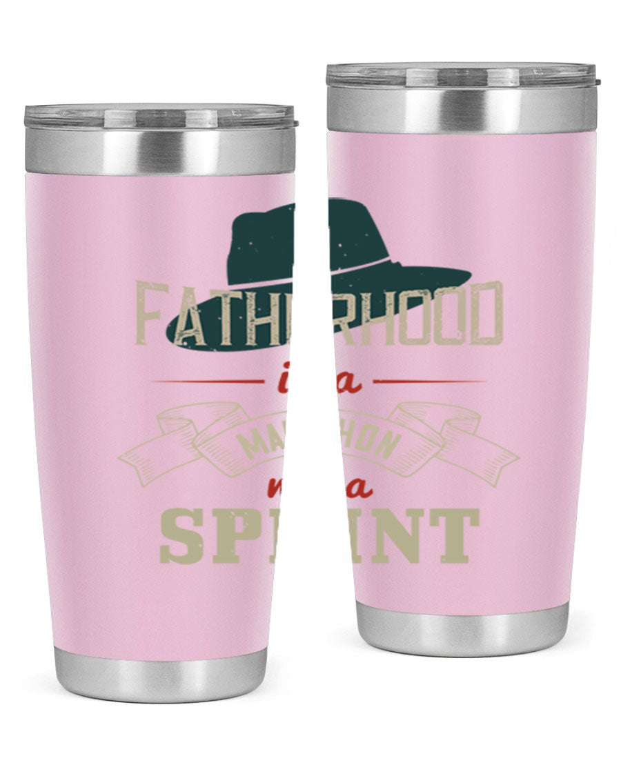 A stylish 'Fatherhood is a Marathon' tumbler in stainless steel, featuring a drink-thru lid and vibrant print, perfect for hot and cold beverages.