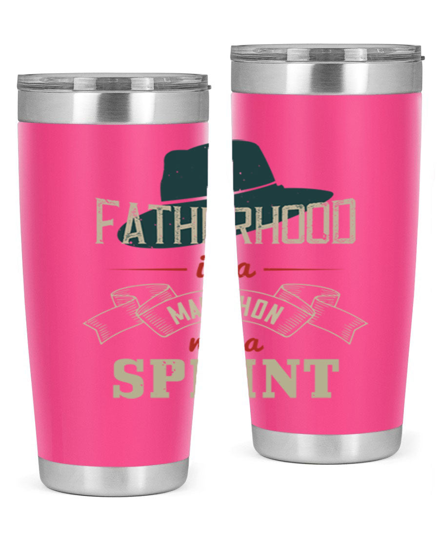 A stylish 'Fatherhood is a Marathon' tumbler in stainless steel, featuring a drink-thru lid and vibrant print, perfect for hot and cold beverages.