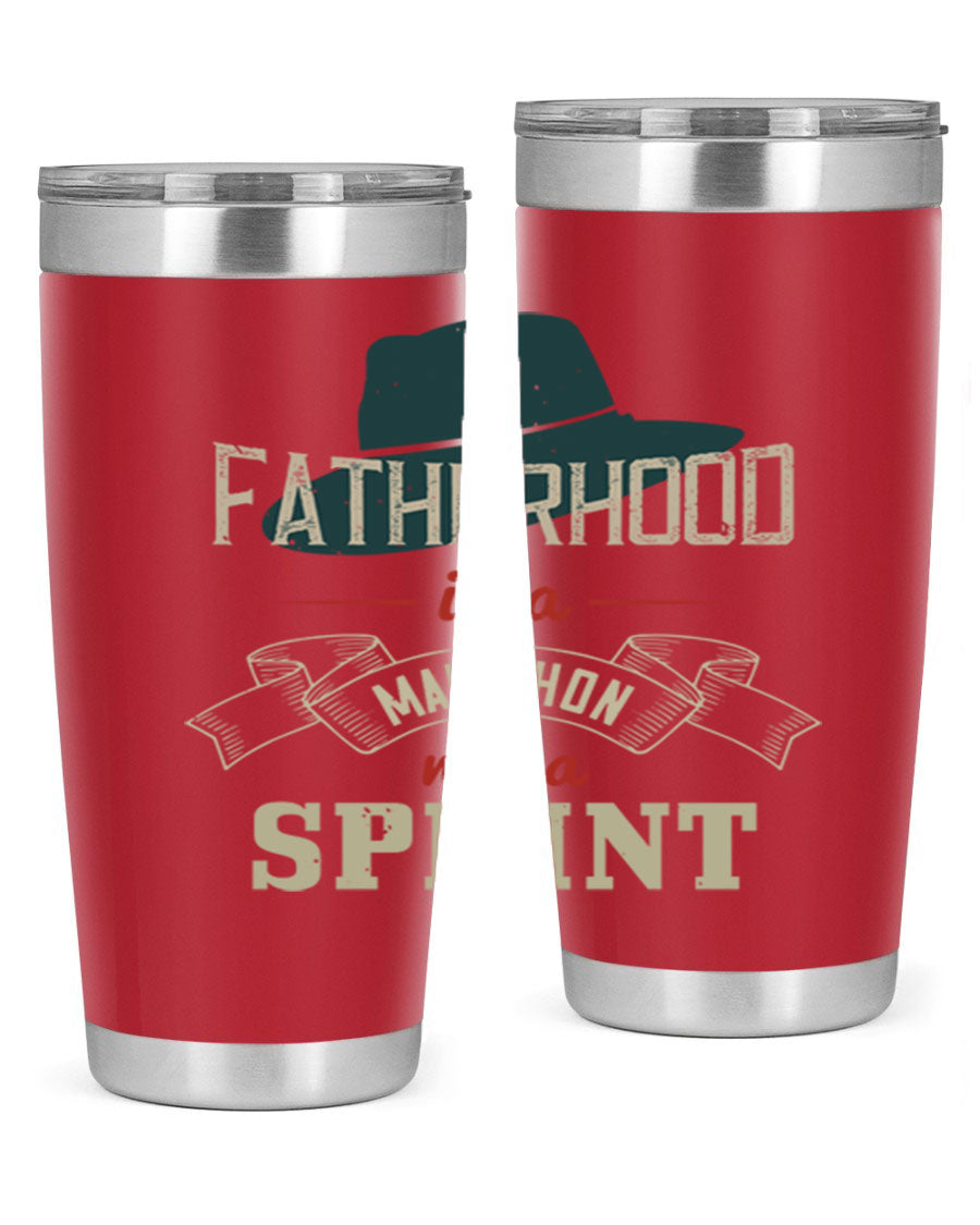 A stylish 'Fatherhood is a Marathon' tumbler in stainless steel, featuring a drink-thru lid and vibrant print, perfect for hot and cold beverages.