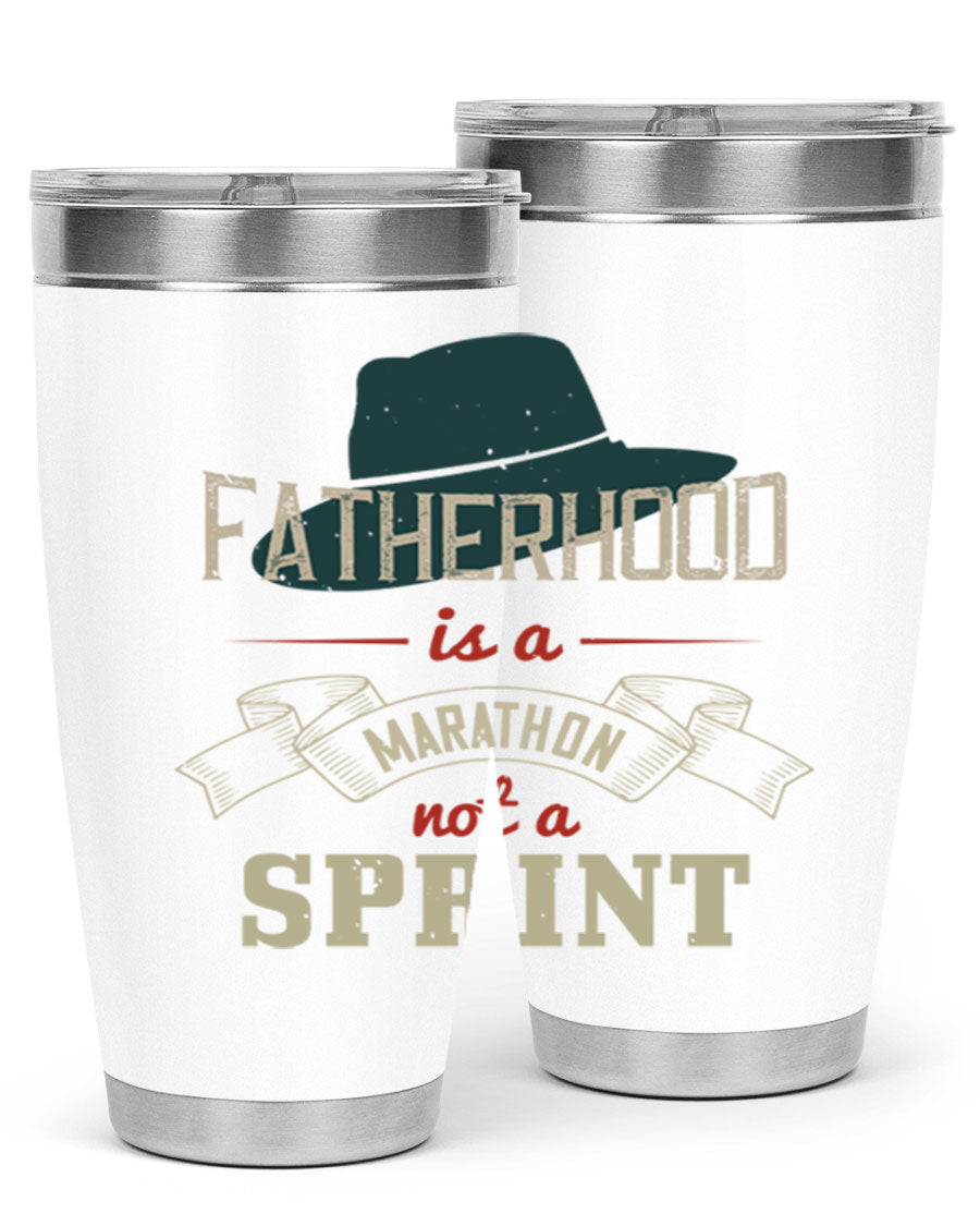 A stylish 'Fatherhood is a Marathon' tumbler in stainless steel, featuring a drink-thru lid and vibrant print, perfect for hot and cold beverages.