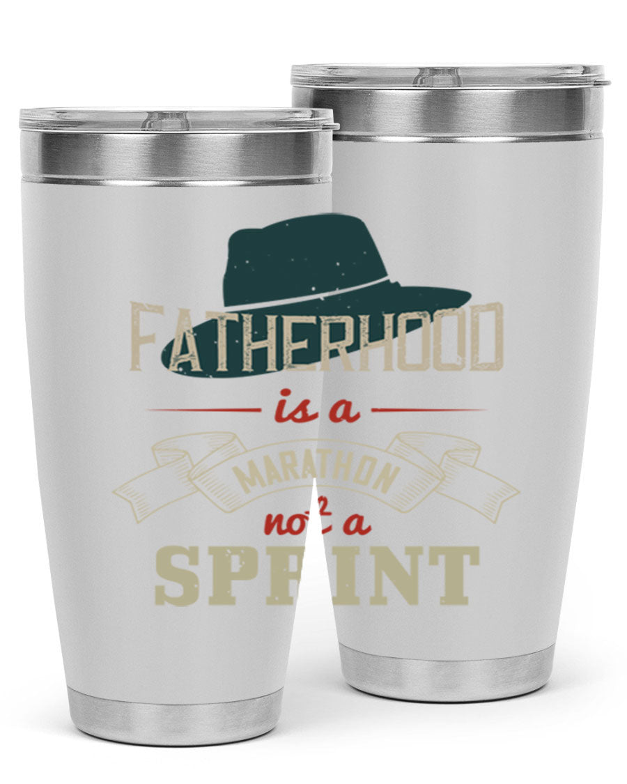 A stylish 'Fatherhood is a Marathon' tumbler in stainless steel, featuring a drink-thru lid and vibrant print, perfect for hot and cold beverages.