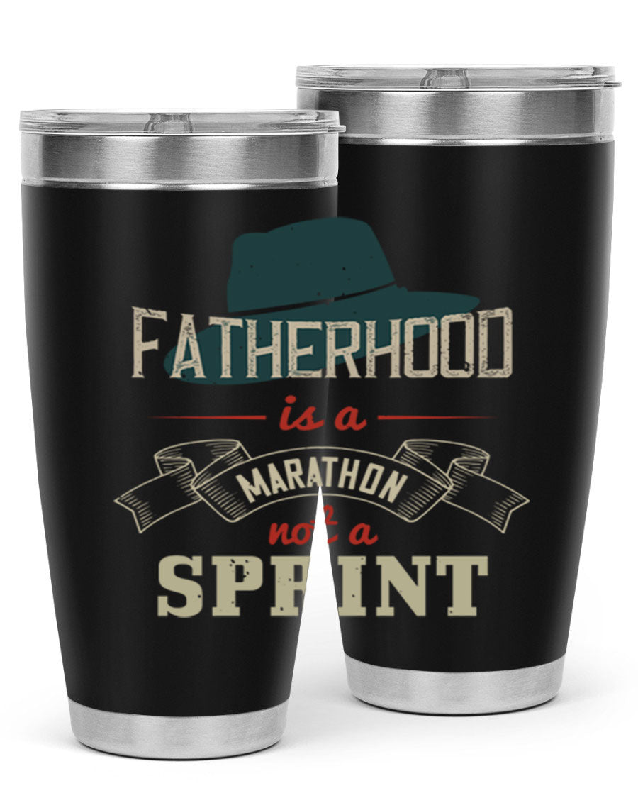 A stylish 'Fatherhood is a Marathon' tumbler in stainless steel, featuring a drink-thru lid and vibrant print, perfect for hot and cold beverages.