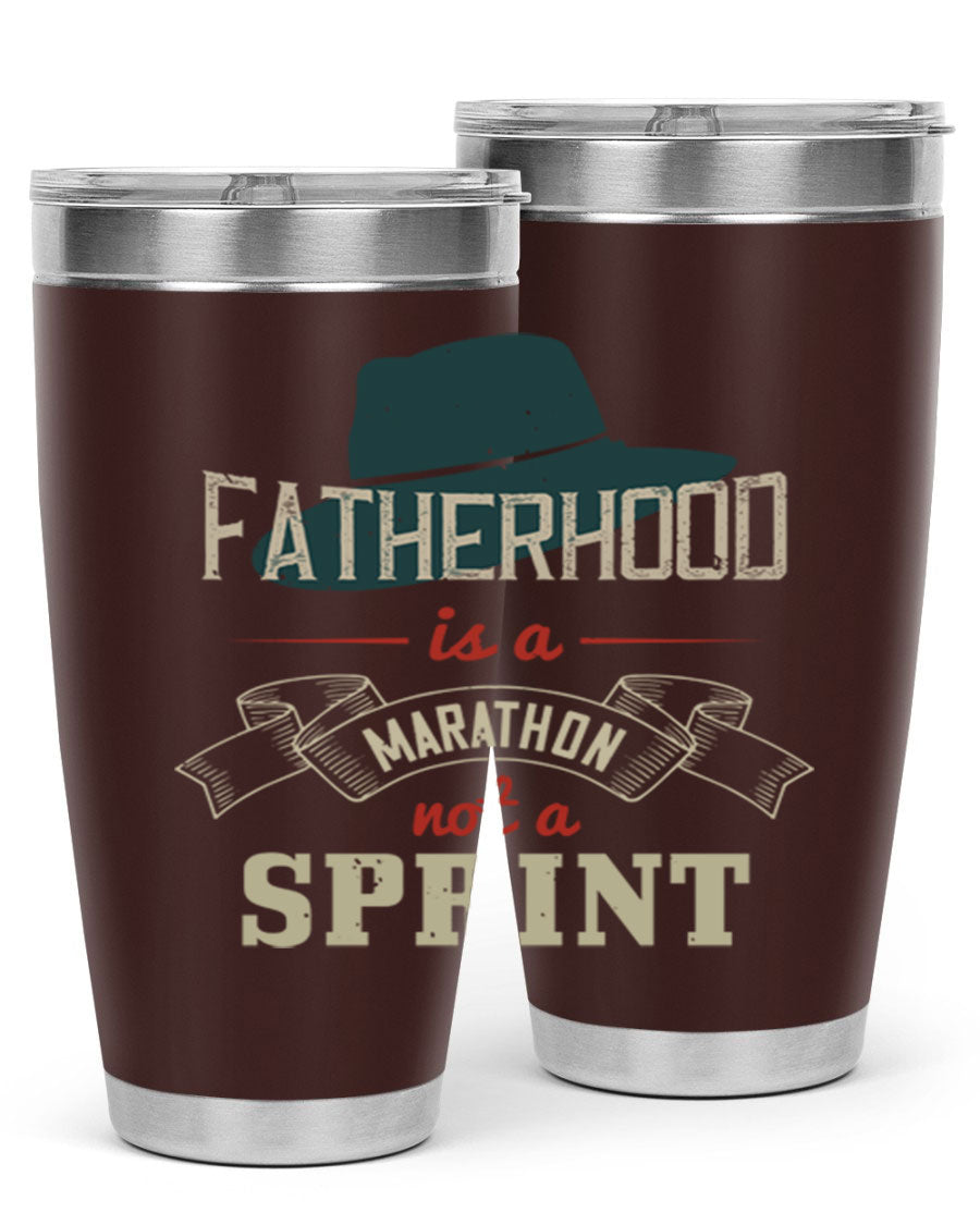 A stylish 'Fatherhood is a Marathon' tumbler in stainless steel, featuring a drink-thru lid and vibrant print, perfect for hot and cold beverages.