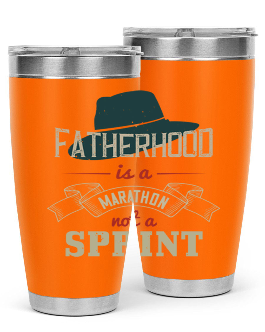 A stylish 'Fatherhood is a Marathon' tumbler in stainless steel, featuring a drink-thru lid and vibrant print, perfect for hot and cold beverages.