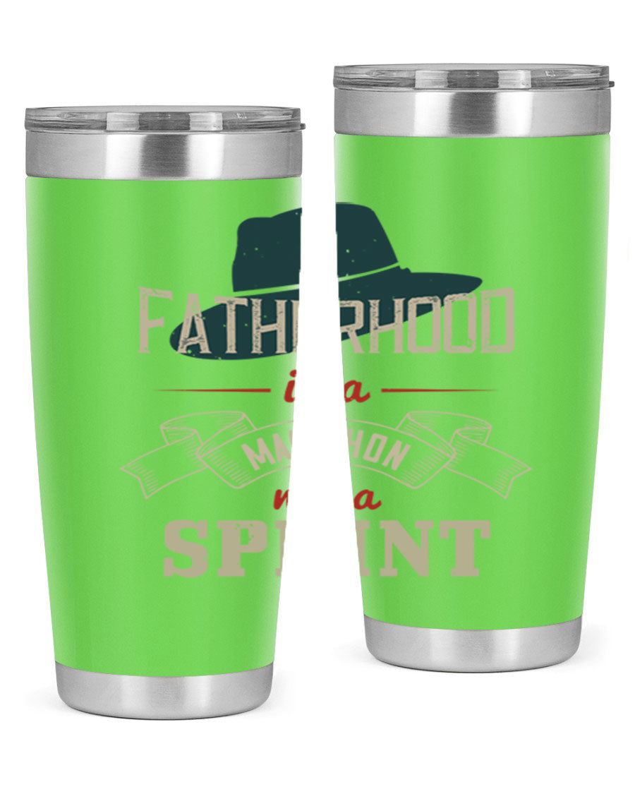 A stylish 'Fatherhood is a Marathon' tumbler in stainless steel, featuring a drink-thru lid and vibrant print, perfect for hot and cold beverages.