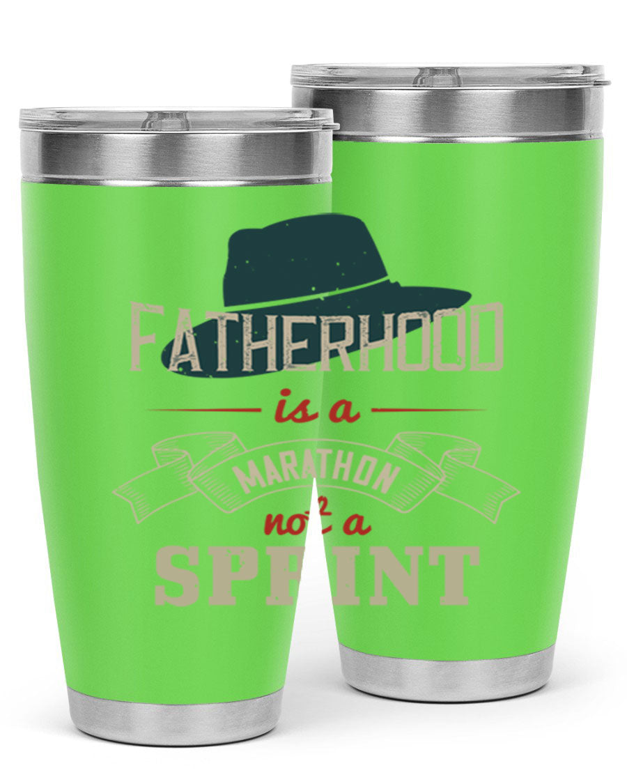 A stylish 'Fatherhood is a Marathon' tumbler in stainless steel, featuring a drink-thru lid and vibrant print, perfect for hot and cold beverages.