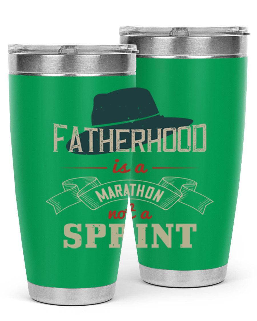 A stylish 'Fatherhood is a Marathon' tumbler in stainless steel, featuring a drink-thru lid and vibrant print, perfect for hot and cold beverages.
