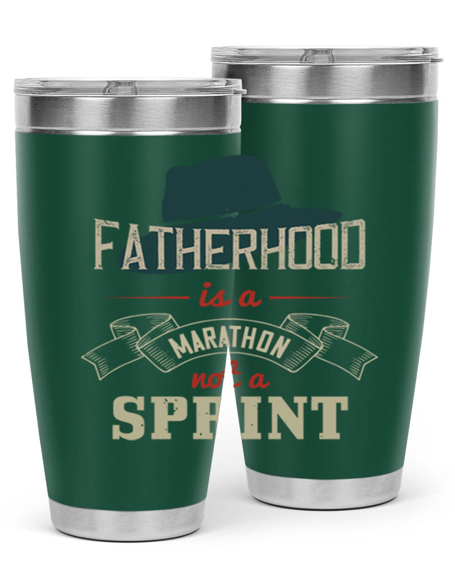 A stylish 'Fatherhood is a Marathon' tumbler in stainless steel, featuring a drink-thru lid and vibrant print, perfect for hot and cold beverages.