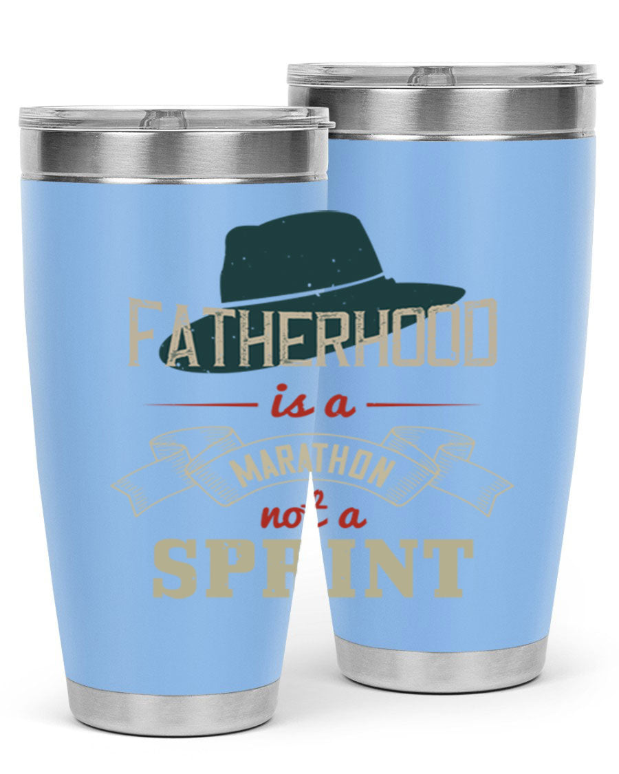 A stylish 'Fatherhood is a Marathon' tumbler in stainless steel, featuring a drink-thru lid and vibrant print, perfect for hot and cold beverages.