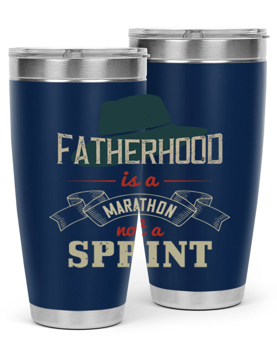 A stylish 'Fatherhood is a Marathon' tumbler in stainless steel, featuring a drink-thru lid and vibrant print, perfect for hot and cold beverages.