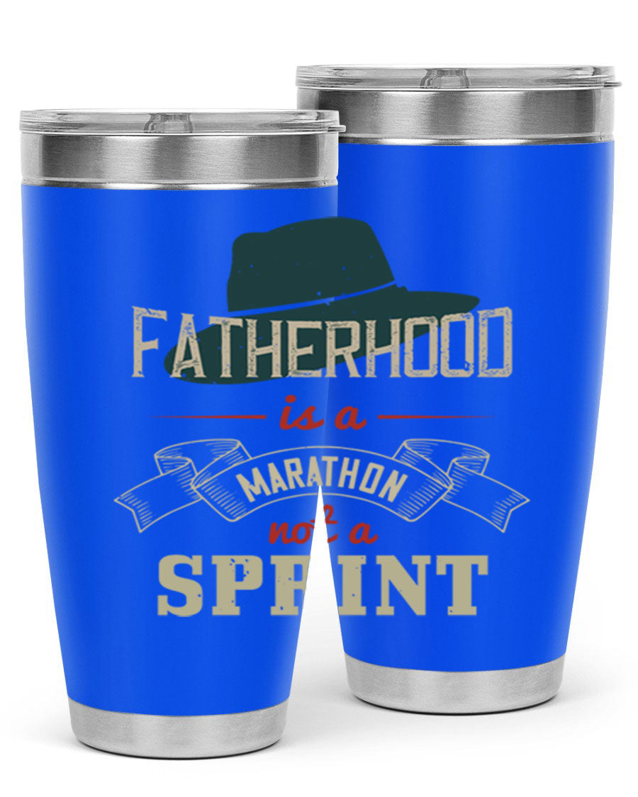 A stylish 'Fatherhood is a Marathon' tumbler in stainless steel, featuring a drink-thru lid and vibrant print, perfect for hot and cold beverages.