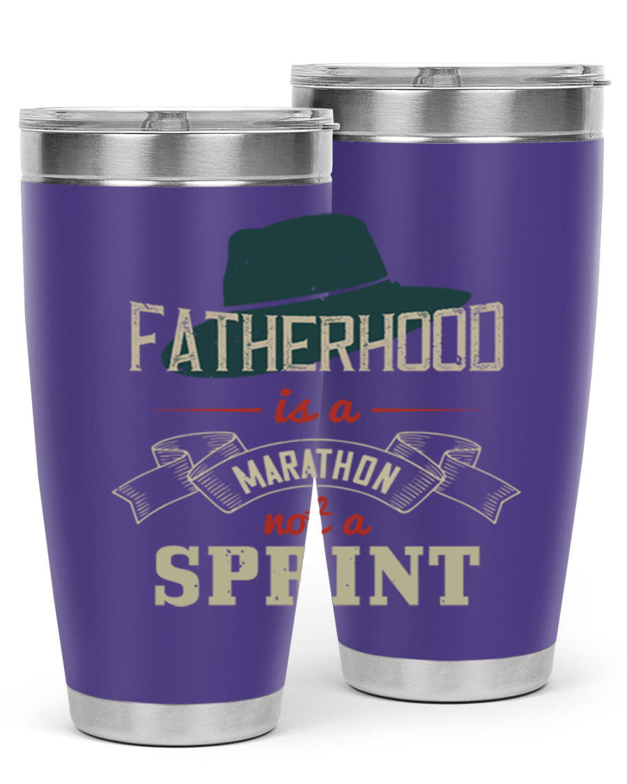 A stylish 'Fatherhood is a Marathon' tumbler in stainless steel, featuring a drink-thru lid and vibrant print, perfect for hot and cold beverages.