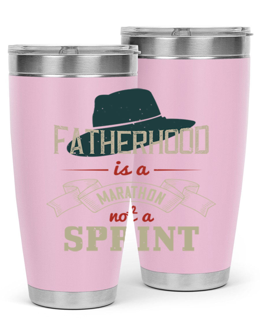 A stylish 'Fatherhood is a Marathon' tumbler in stainless steel, featuring a drink-thru lid and vibrant print, perfect for hot and cold beverages.