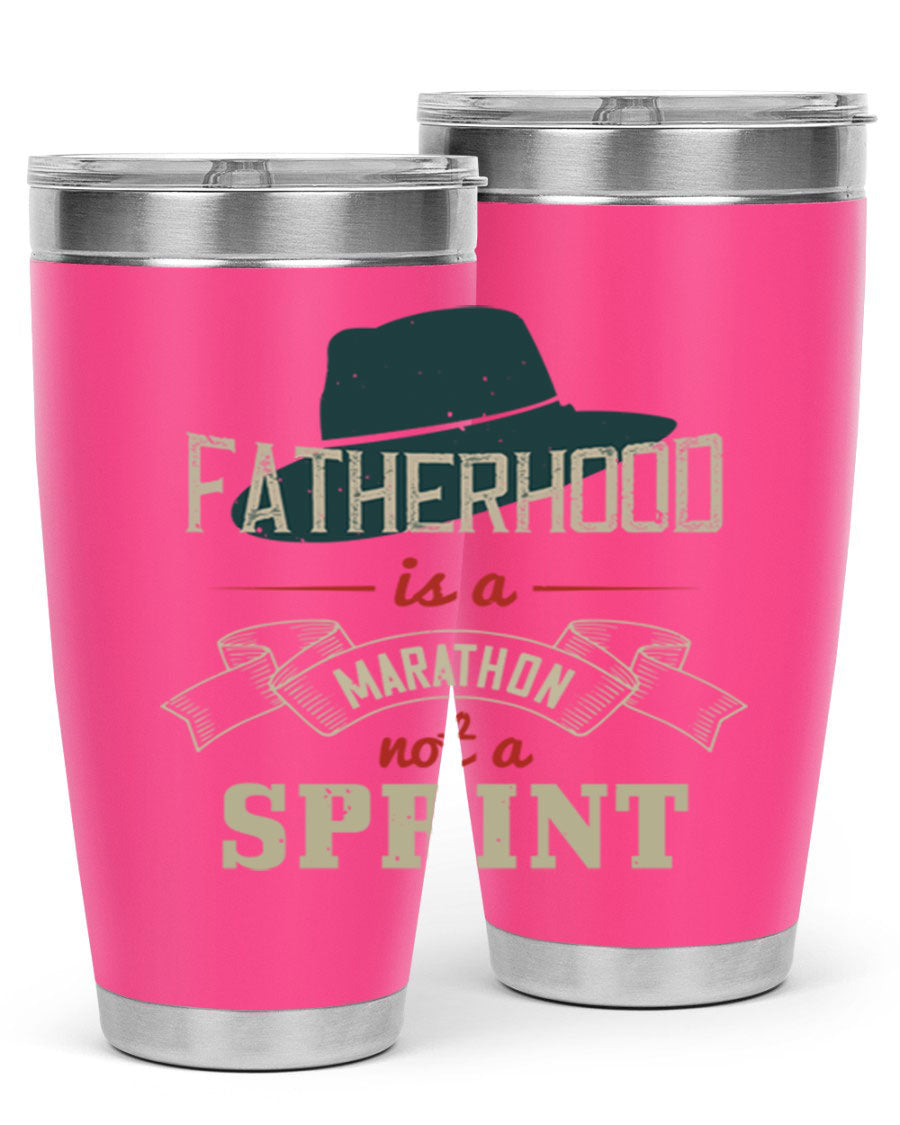 A stylish 'Fatherhood is a Marathon' tumbler in stainless steel, featuring a drink-thru lid and vibrant print, perfect for hot and cold beverages.
