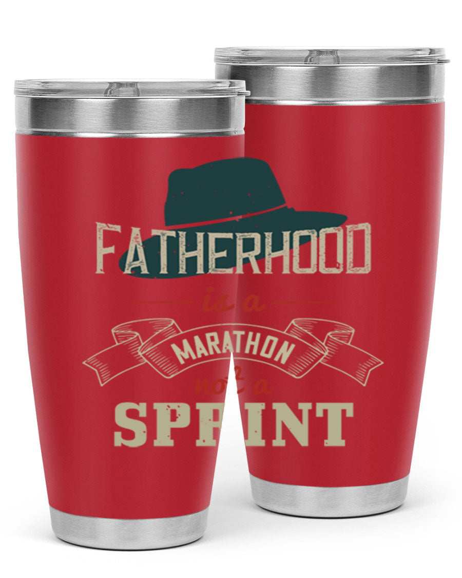 A stylish 'Fatherhood is a Marathon' tumbler in stainless steel, featuring a drink-thru lid and vibrant print, perfect for hot and cold beverages.