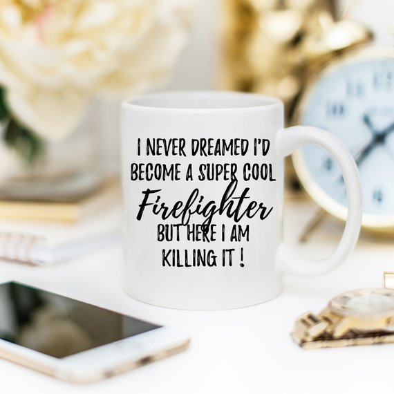 A white ceramic mug featuring a vibrant firefighter design printed on both sides, perfect for coffee or tea.