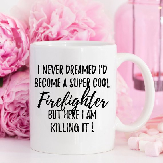 A white ceramic mug featuring a vibrant firefighter design printed on both sides, perfect for coffee or tea.