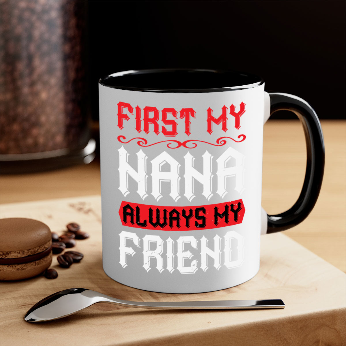 Ceramic coffee mug with a glossy finish, featuring a colored handle and interior, displaying the text 'FIRST MY NANA ALWAYS MY FRIEND'.