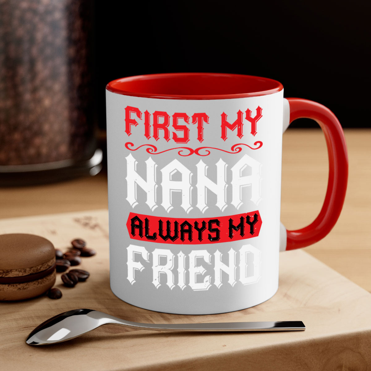 Ceramic coffee mug with a glossy finish, featuring a colored handle and interior, displaying the text 'FIRST MY NANA ALWAYS MY FRIEND'.