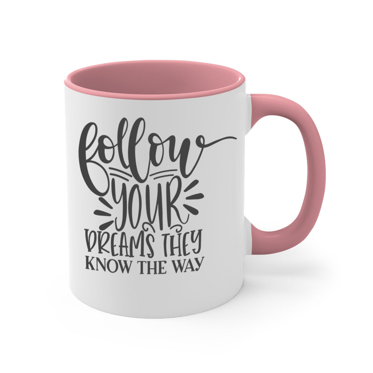 A two-tone ceramic mug with the motivational phrase 'Follow Your Dreams They Know the Way', featuring a glossy finish and a colored handle.