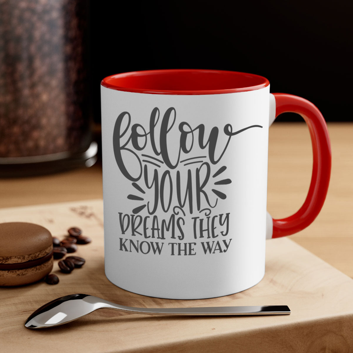 A two-tone ceramic mug with the motivational phrase 'Follow Your Dreams They Know the Way', featuring a glossy finish and a colored handle.