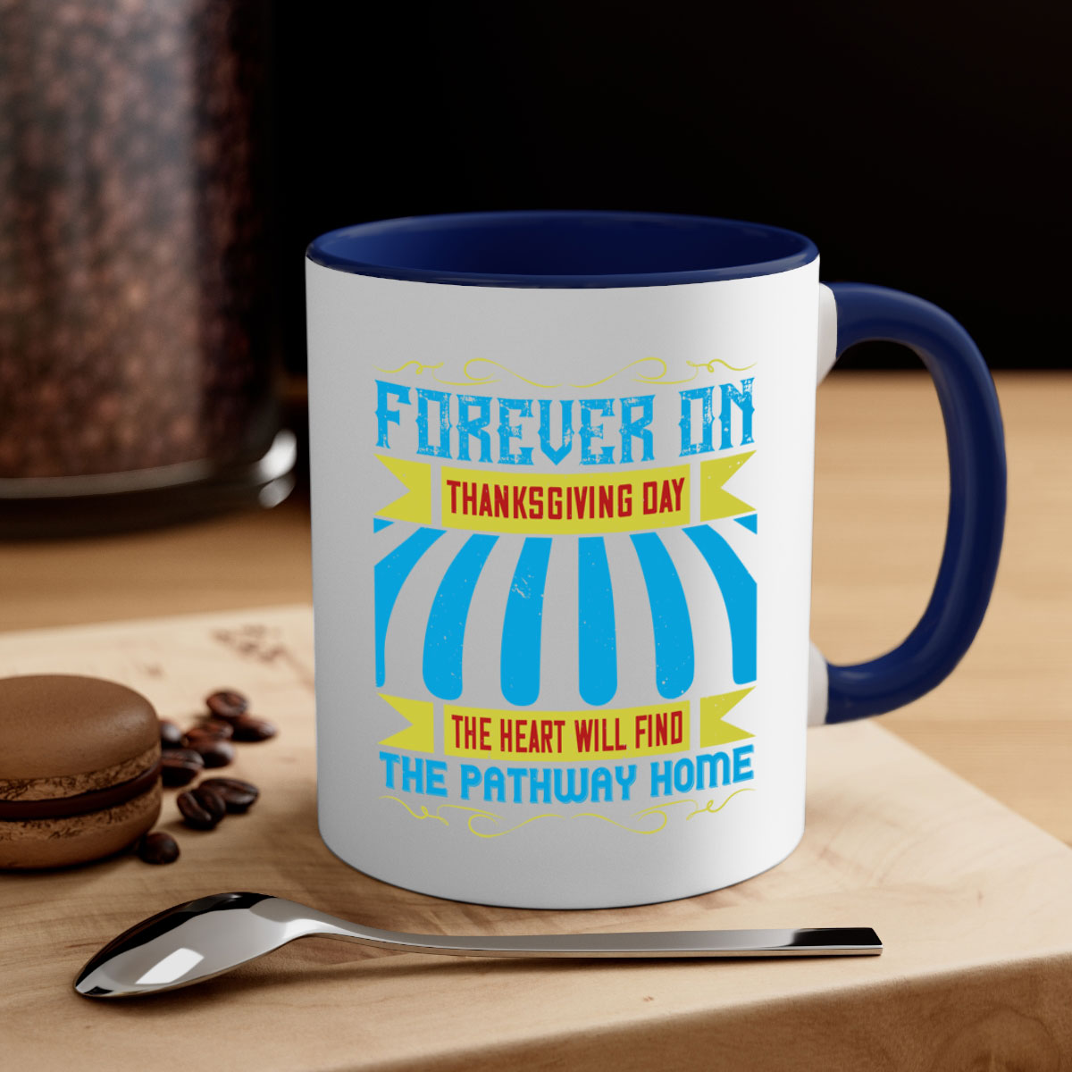 A two-tone ceramic mug with a colored handle and interior, featuring the phrase 'Forever on Thanksgiving Day the Heart Will Find the Pathway Home'.