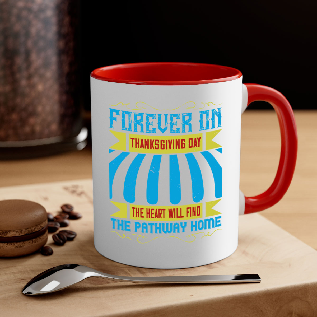 A two-tone ceramic mug with a colored handle and interior, featuring the phrase 'Forever on Thanksgiving Day the Heart Will Find the Pathway Home'.