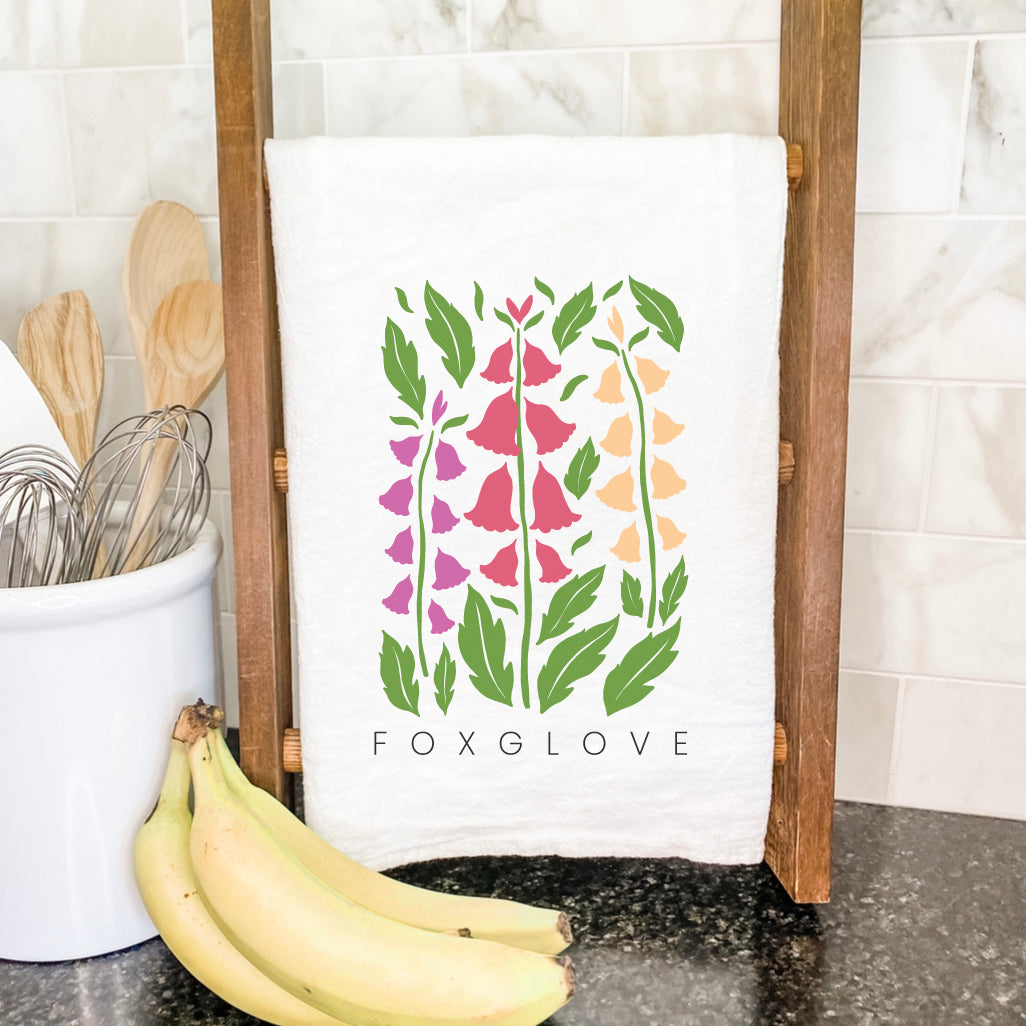Foxglove Cotton Tea Towel featuring a vibrant floral design, made from 100% absorbent cotton, ideal for kitchen use.